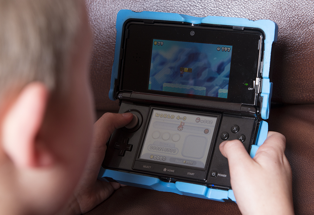 Lucius playing 3DS his Christmas present