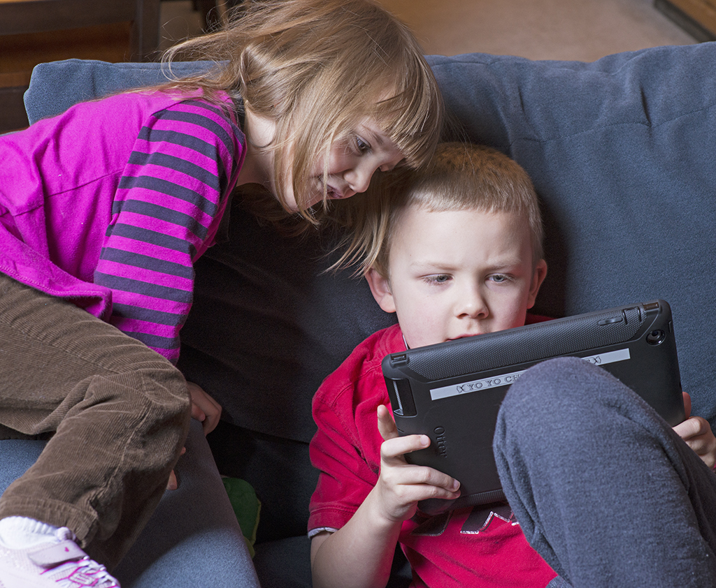 RayRay and Lucius playing iPad